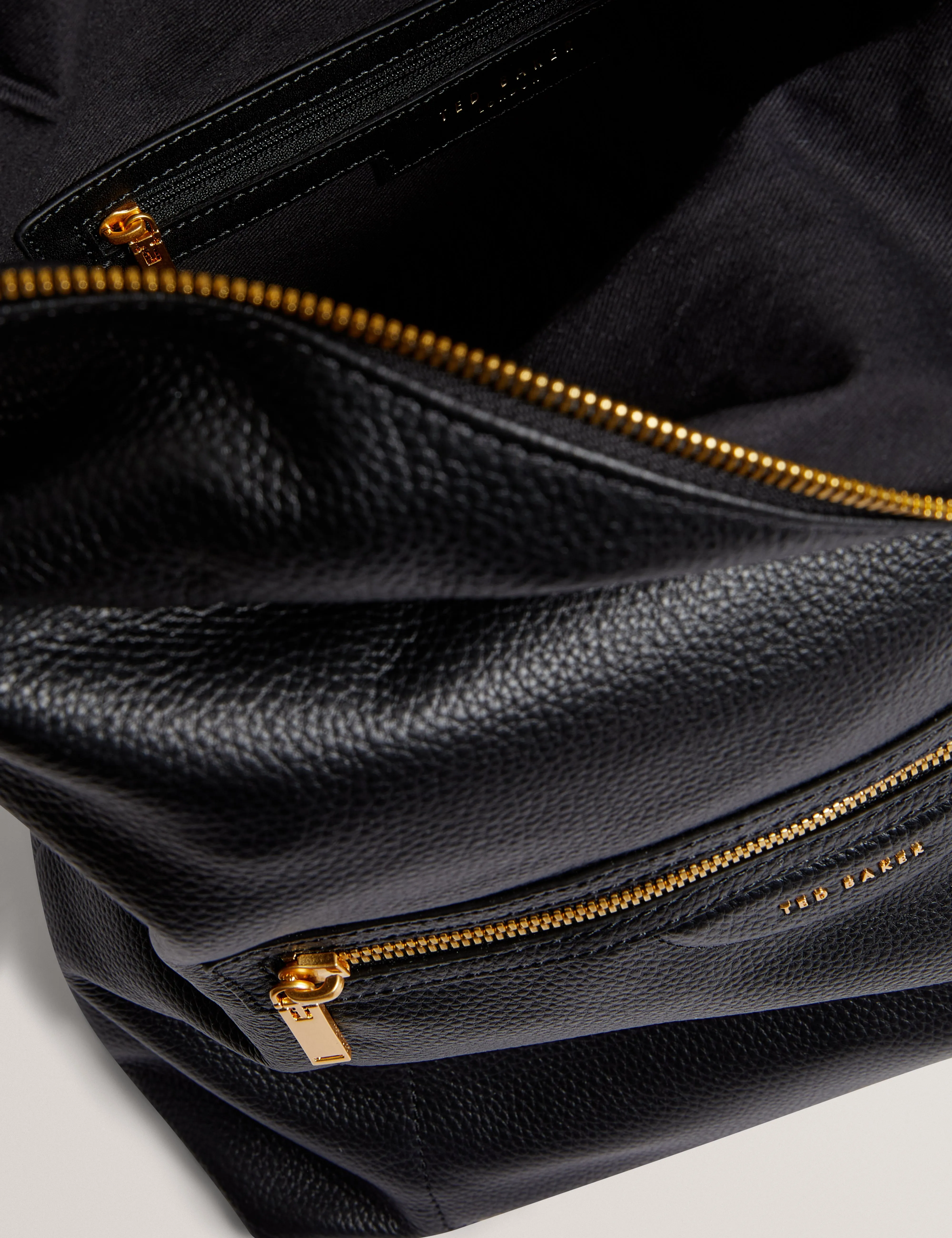 Essaya Pebbled Leather Fold Over Backpack Black